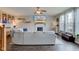 Spacious living room features a fireplace, a large screen TV, hardwood floors, and a comfortable sectional sofa at 8218 Elsen Ridge, Avon, IN 46123