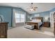 Spacious main bedroom features a vaulted ceiling, a ceiling fan, and natural light from the window at 8218 Elsen Ridge, Avon, IN 46123