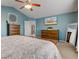 Bright main bedroom showcasing dressers, decor, and a mounted TV for entertainment at 8218 Elsen Ridge, Avon, IN 46123