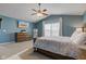 Inviting main bedroom features natural light, dressers, and a mounted TV at 8218 Elsen Ridge, Avon, IN 46123