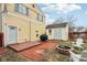 A cozy backyard featuring a fire pit, seating area, and a storage shed at 854 W Roache St, Indianapolis, IN 46208