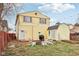 A cozy backyard featuring a fire pit, seating area, and a storage shed at 854 W Roache St, Indianapolis, IN 46208