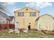 A cozy backyard featuring a fire pit, seating area, and a storage shed at 854 W Roache St, Indianapolis, IN 46208