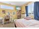 Bedroom featuring a window, bed, desk and television at 854 W Roache St, Indianapolis, IN 46208