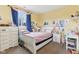 Bedroom featuring a white bed frame with a pink blanket at 854 W Roache St, Indianapolis, IN 46208