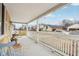 Spacious covered front porch with classic white railings, perfect for enjoying the outdoors at 854 W Roache St, Indianapolis, IN 46208