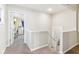 Upstairs hallway with neutral paint and carpet at 854 W Roache St, Indianapolis, IN 46208