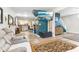 Spacious open-concept living room with modern decor, hardwood floors, and a large wall-mounted TV at 854 W Roache St, Indianapolis, IN 46208