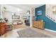 Open-concept living room featuring hardwood floors, fireplace, and stylish decor at 854 W Roache St, Indianapolis, IN 46208