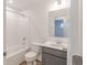 Bathroom with gray vanity, white counter, a mirror, and shower/tub combo at 9345 Anthem Ave, Plainfield, IN 46168