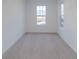 Neutral bedroom featuring carpeted floors and two bright windows at 9345 Anthem Ave, Plainfield, IN 46168