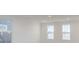 Spacious bedroom with three bright windows and neutral paint at 9345 Anthem Ave, Plainfield, IN 46168