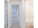 View of carpeted hallway leading to bedroom and bathroom at 9345 Anthem Ave, Plainfield, IN 46168