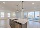 Kitchen with a large island, stainless steel appliances, and hardwood floors at 9345 Anthem Ave, Plainfield, IN 46168