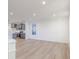 Open-concept living area with sleek floors, recessed lighting, and gray cabinets at 9345 Anthem Ave, Plainfield, IN 46168