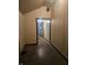 Narrow hallway showcasing dated paneling, trim, and weathered flooring at 1031 Nichol Ave, Anderson, IN 46016