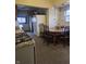 Kitchen with dated appliances, tile floor, and an eat-in dining table at 1031 Nichol Ave, Anderson, IN 46016