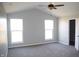 Bright bedroom with neutral carpet, high ceilings, and dual windows for ample natural light at 1393 N Salem Ct, Greenfield, IN 46140