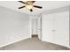Comfortable bedroom with ceiling fan, carpeted floors, and large closet at 1393 N Salem Ct, Greenfield, IN 46140