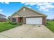 Charming brick home with a well-manicured lawn, inviting entrance, and a two-car garage at 1393 N Salem Ct, Greenfield, IN 46140