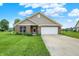 Charming brick home with a well-manicured lawn, inviting entrance, and a two-car garage at 1393 N Salem Ct, Greenfield, IN 46140