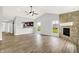 Bright living room with vaulted ceilings, fireplace, and pass-through to kitchen at 1393 N Salem Ct, Greenfield, IN 46140