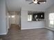 Open concept living space with modern flooring and a pass-through to the kitchen area at 1393 N Salem Ct, Greenfield, IN 46140