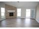 Inviting living room features a stacked stone fireplace, modern flooring, and ample natural light at 1393 N Salem Ct, Greenfield, IN 46140