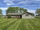 A home with a charming wood deck and a large, well-maintained backyard at 1435 E New Rd, Greenfield, IN 46140