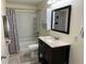 Bathroom with vanity, toilet, and shower/tub combo with shower curtain at 1435 E New Rd, Greenfield, IN 46140