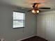 Bedroom with a window, ceiling fan, and closet at 1435 E New Rd, Greenfield, IN 46140