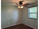 Bedroom with carpeted floor, window and ceiling fan at 1435 E New Rd, Greenfield, IN 46140
