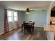 Dining room with wood floors, a ceiling fan, and a table with four chairs at 1435 E New Rd, Greenfield, IN 46140