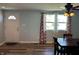 Dining area features wood flooring, a ceiling fan, and a window at 1435 E New Rd, Greenfield, IN 46140