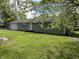 A single-story home with vinyl siding, a 2-car garage, and a well-maintained yard at 1435 E New Rd, Greenfield, IN 46140