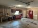 Large garage with work bench area, storage, and ample open space at 1435 E New Rd, Greenfield, IN 46140