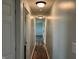 Neutral hallway with hardwood flooring and bright overhead lighting at 1435 E New Rd, Greenfield, IN 46140
