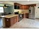 Kitchen with stainless steel appliances and view into the dining room at 1435 E New Rd, Greenfield, IN 46140