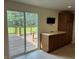 Kitchen area view of the sliding glass doors leading to a deck at 1435 E New Rd, Greenfield, IN 46140