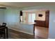 Open kitchen and dining area with breakfast bar and wood floors at 1435 E New Rd, Greenfield, IN 46140