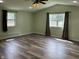 Bright living room featuring hardwood floors, vaulted ceiling and lots of natural light at 1435 E New Rd, Greenfield, IN 46140