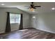 Open living room with hardwood floors, recessed lighting, and a front door entrance at 1435 E New Rd, Greenfield, IN 46140