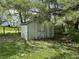 Outdoor storage shed with double doors in a shaded backyard at 1435 E New Rd, Greenfield, IN 46140