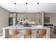 Modern kitchen features a large marble island, stainless steel appliances and pendant lighting at 1517 E New York St, Indianapolis, IN 46201