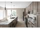 Beautiful kitchen with a granite island, stainless steel appliances, and large windows at 1517 E New York St, Indianapolis, IN 46201