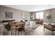 Open-concept living area featuring hardwood floors, neutral walls, and stylish furnishings at 1517 E New York St, Indianapolis, IN 46201