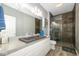 Modern bathroom with a concrete sink and a stylish walk-in shower with tile surround at 1623 N College Ave # 2, Indianapolis, IN 46202