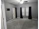 Spacious bedroom featuring a ceiling fan and a door leading to the outside at 1623 N College Ave # 2, Indianapolis, IN 46202
