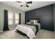 Comfortable bedroom with ceiling fan and natural light at 1623 N College Ave # 2, Indianapolis, IN 46202