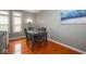 Dining area with seating for four, hardwood floors and natural light at 1623 N College Ave # 2, Indianapolis, IN 46202